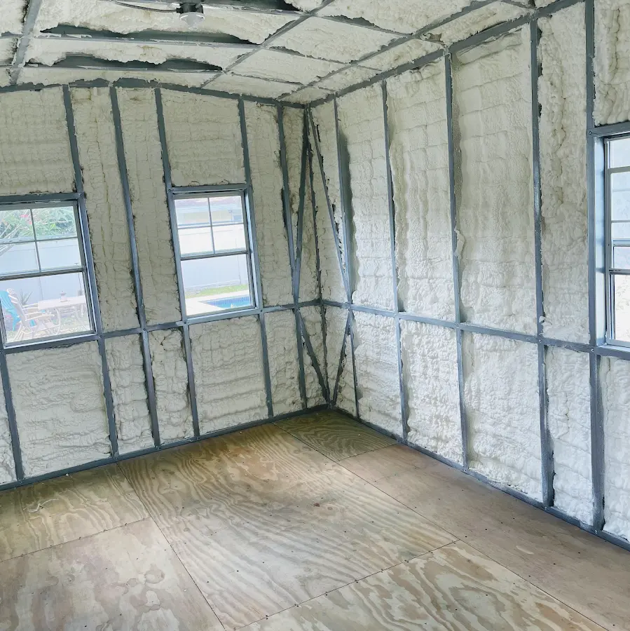 Closed-cell spray foam insulation applied to wall cavities in a residential project in Myrtle Grove